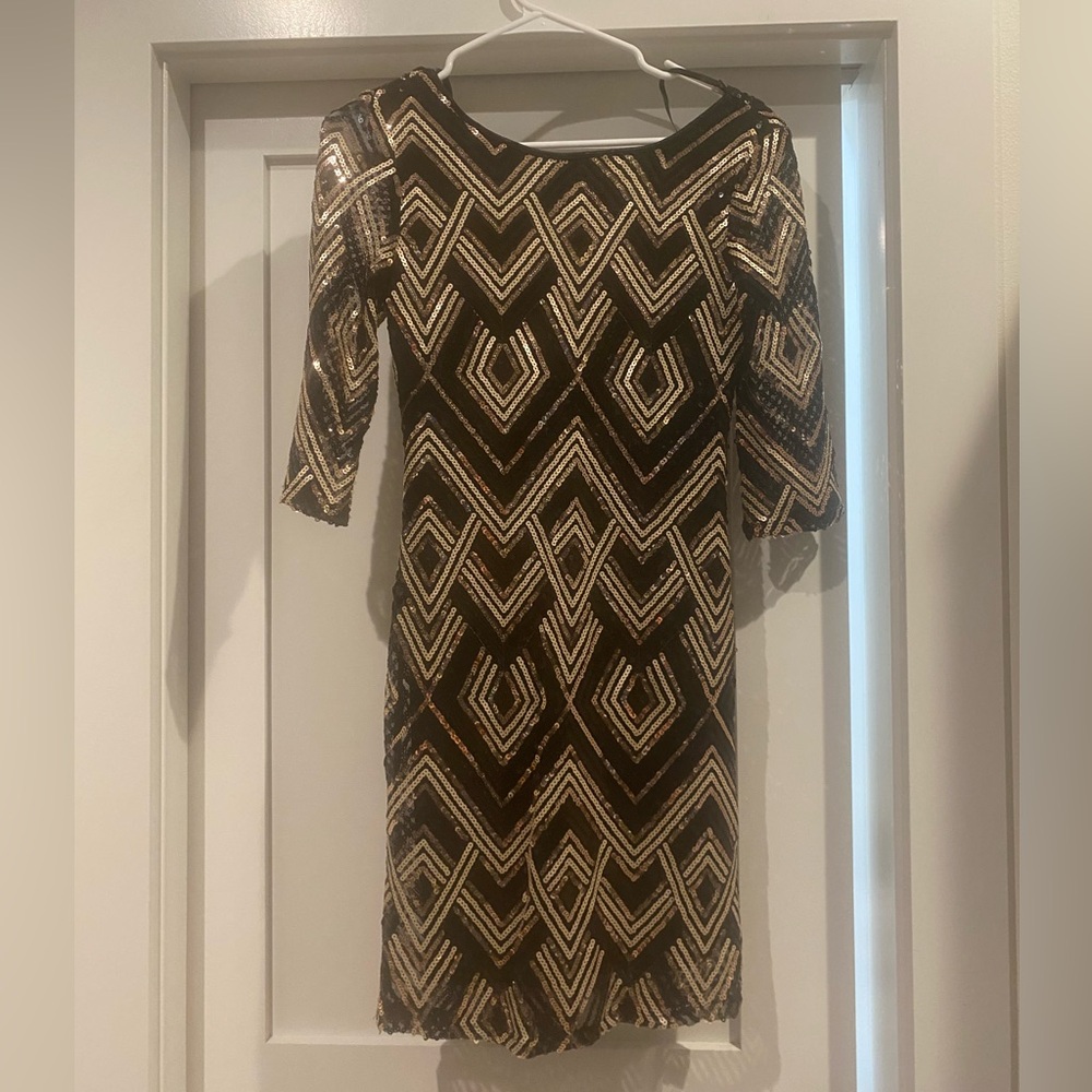 Black and gold sequin dress. Perfect for New Year’s Eve!!